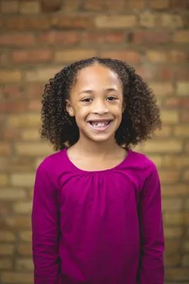 Playful kid headshot on location